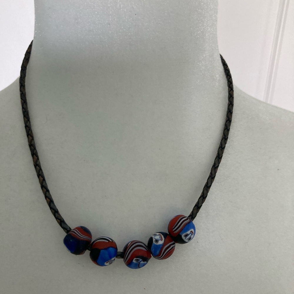Vintage African Hand Made Ghost Beads sourced in Africa. Leather braided cord.
